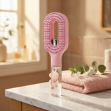The Mist Ritual Brush on a marble bathroom vanity in soft morning light